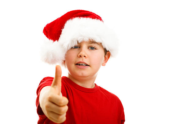 istock Christmas time - boy with Santa Clause hat 624182008