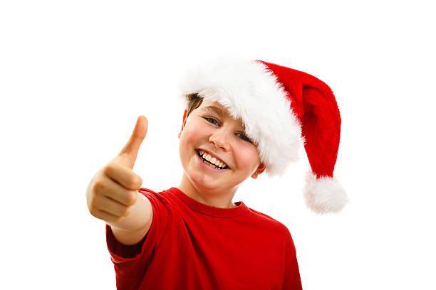 istock Christmas time - boy with Santa Clause hat 624182022