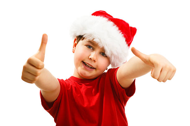 istock Christmas time - boy with Santa Clause hat 624182038