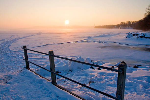istock Sunrise over frozen lake 624184776