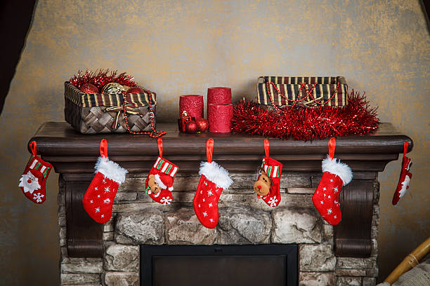istock Christmas red stocking hanging from a mantel or fireplace, decor 624185646