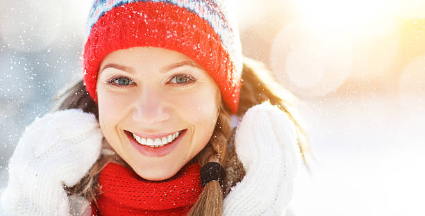 istock happy young woman in winter for a walk 624186066