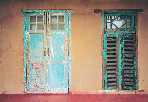istock Vintage style old aged house door and window 624186314