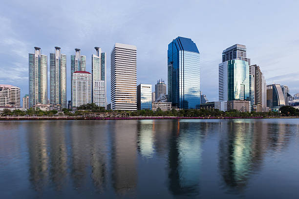 istock Office building with water reflection and twilight sky 624193580