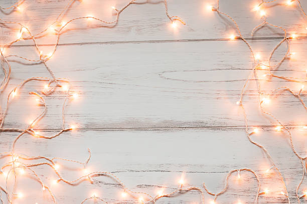 istock Christmas lights wooden background 624194158