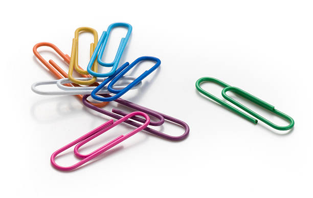 istock Colored paper clips on a white background. Top view. 624194500