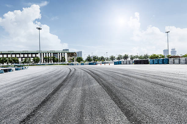 Rubber drift traces and traffic cones inside a driving school polygon