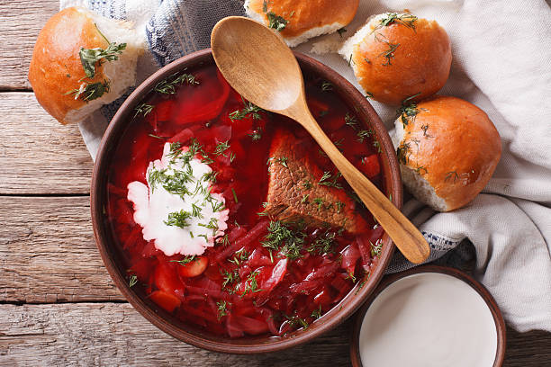 istock Ukrainian borsch soup with sour cream close-up. horizontal top view 624208326
