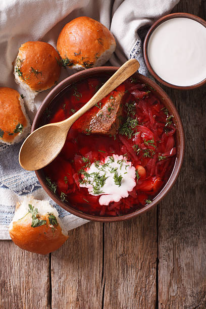 istock Ukrainian borsch soup and garlic buns on the table. vertical 624214658