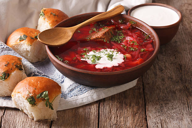 istock Ukrainian borscht red soup with garlic buns on the table 624215384