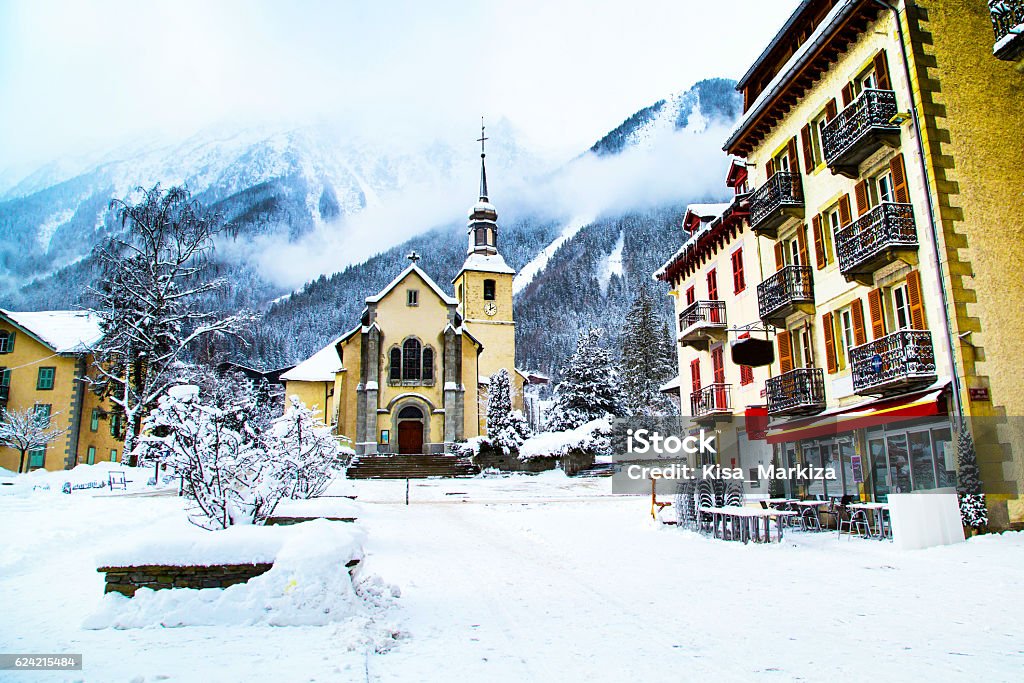 Church in Chamonix town, France, French Alps, part of street Church in Chamonix, France, French Alps in winter, street view and snow mountains Chamonix Stock Photo