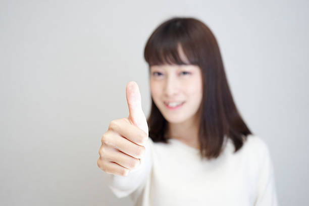 istock Young woman hand with thumb up 624216568