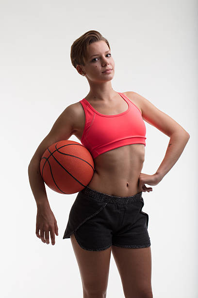 istock young woman with a basketball 624217678