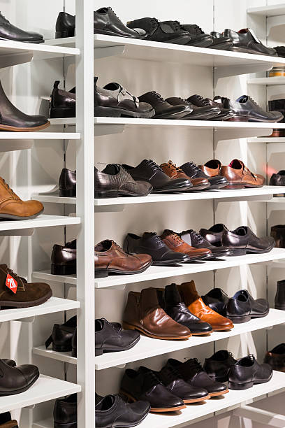 istock shelves with men's leather shoes in a store 624223064