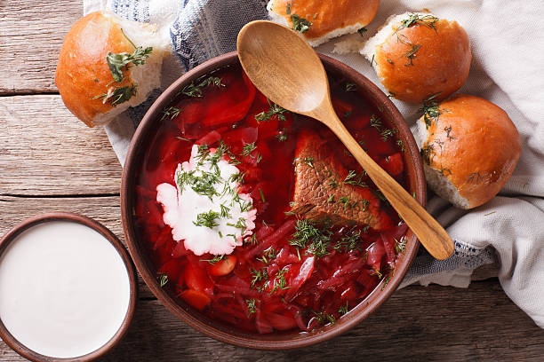 istock Ukrainian borsch soup and garlic buns close-up. Horizontal top view 624223806