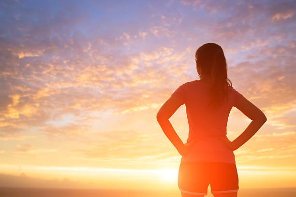 istock silhouette of woman with sunlight 624224702