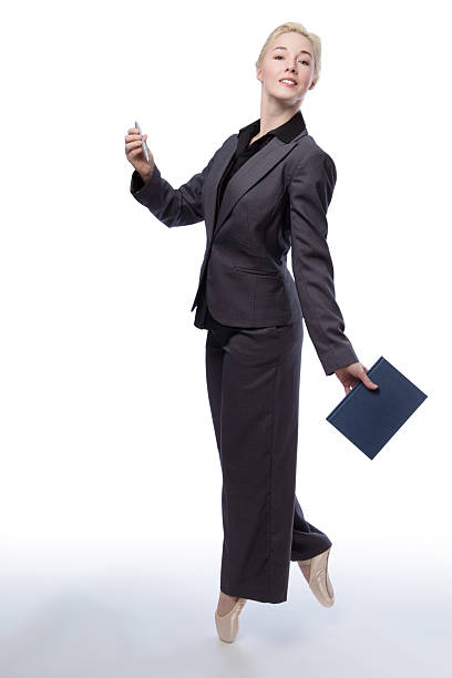 istock business ballerina with book 624224944