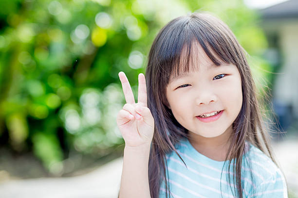 istock little girl smile happily 624225608