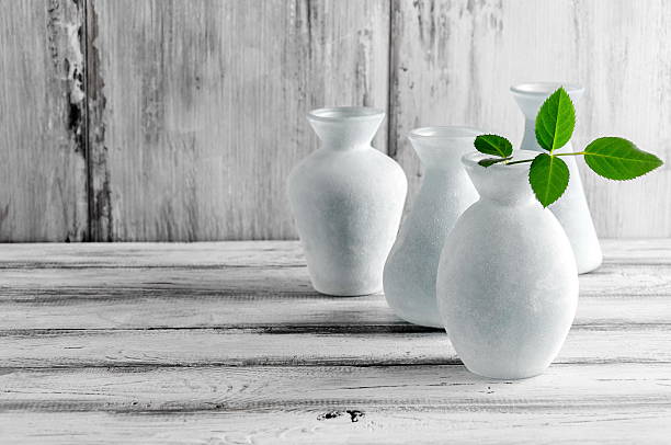 istock Home Decor on a gray background glass vase and twig. 624226792