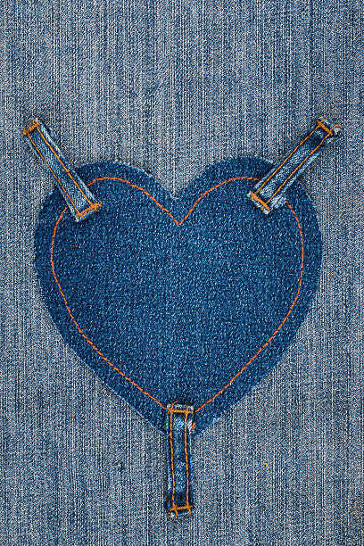 istock Heart made of denim fabric and attached three straps 624249656
