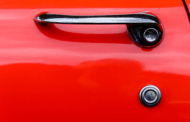 istock Door handle of an orange classic car 624249660