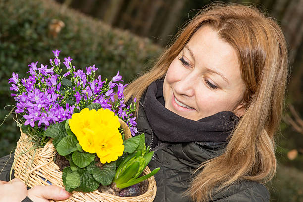 istock Female with flower basket 624249694