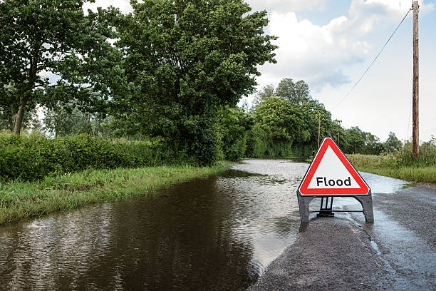 istock road side flooded sign 624250472