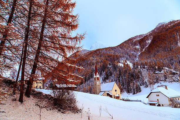 istock snow on the church in the alpine village 624251190