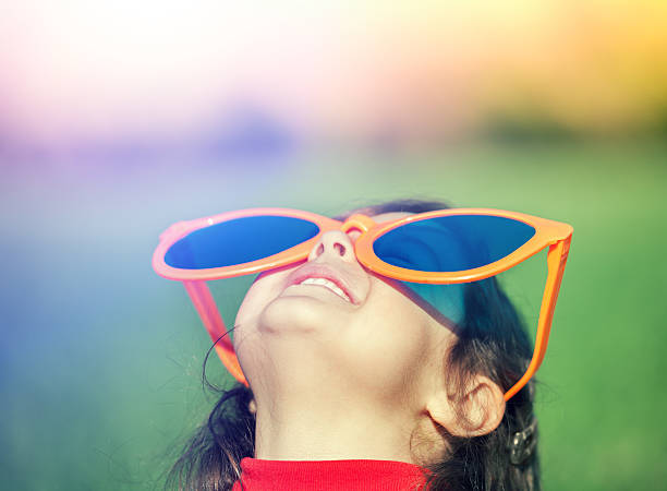 istock girl with big sunglasses looking at the sun 624263532