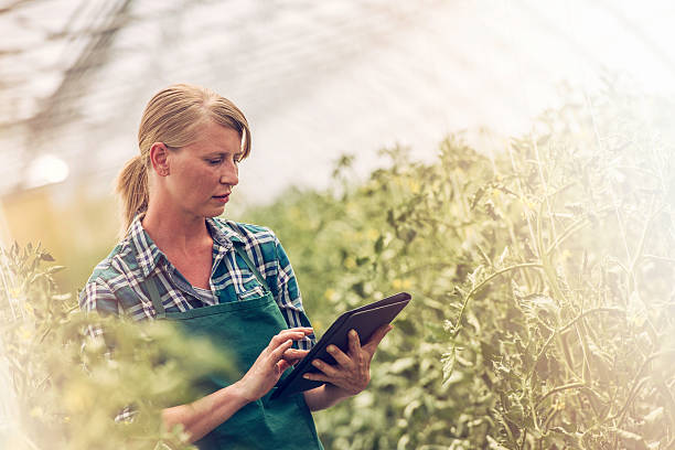 Female gardener with digital tablet