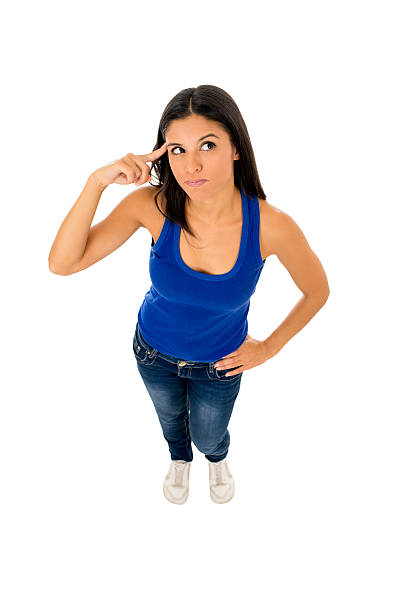 istock hispanic woman pointing her head thinking and wondering confused 624266042