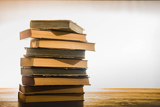 istock Old books on the  wooden table 624280194