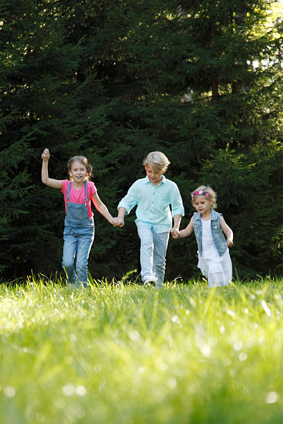 istock Children running in park 624287362