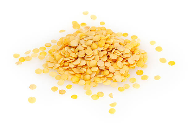 istock Yellow lentils isolated on white background 624287552