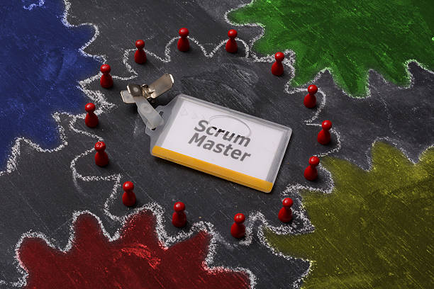 Scrum master badge in the centre Scum master is the center gear of the process Scrum master badge on a blackboard round daily scrum table in an agile project scrum stock pictures, royalty-free photos & images