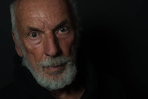 istock Senior Man Portrait, beard,  facial expression, black background 624289106