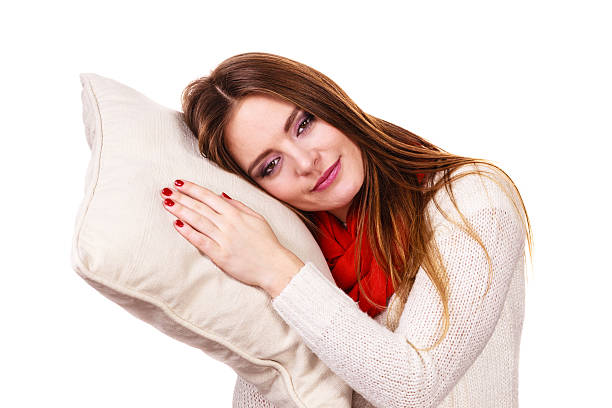 istock Woman sleepy tired with pillow almost falling asleep 624354532