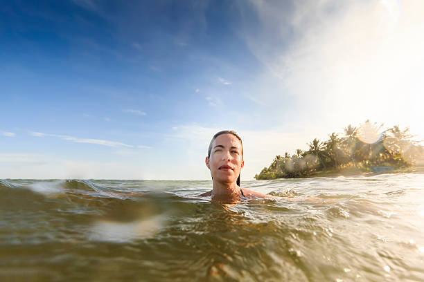 istock Woman Relaxing In Sea on Tropical Beach 624357008