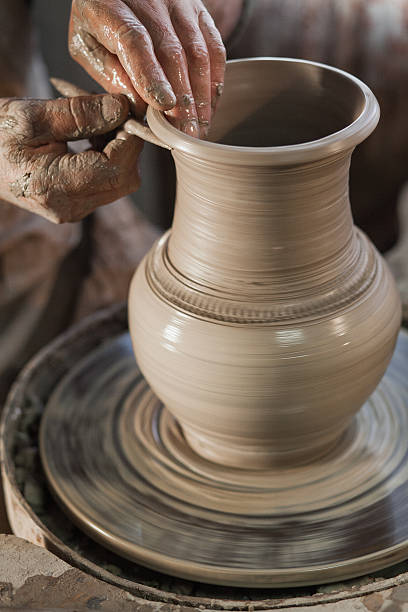 istock Potter working a piece of clay 624357068