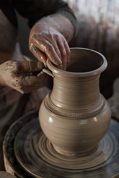 istock Potter working a piece of clay 624357200