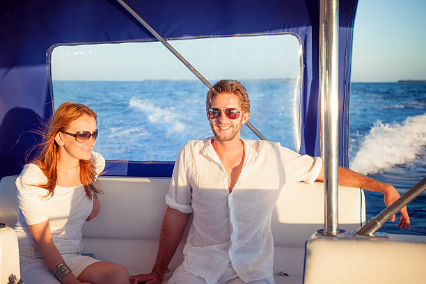 istock smiling rich couple motor boat 624357496