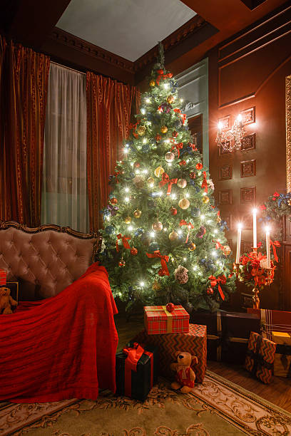 istock Christmas evening by candlelight. classic apartments with a white fireplace 624373582