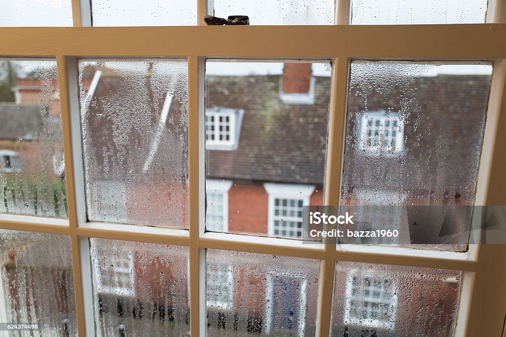 Condensation. Condensation on a sash window overlooking a street in Bury St Edmunds in Suffolk England UK. Sash Window Stock Photo