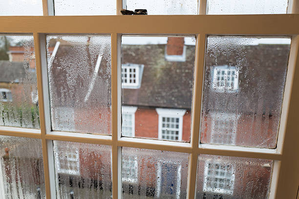 Condensation. Condensation on a sash window overlooking a street in Bury St Edmunds in Suffolk England UK. bury st edmunds photos stock pictures, royalty-free photos & images