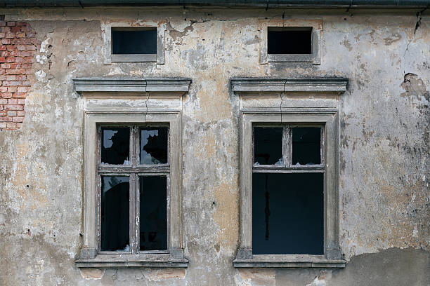istock Old window in ruined wall of an old manor house 624374820