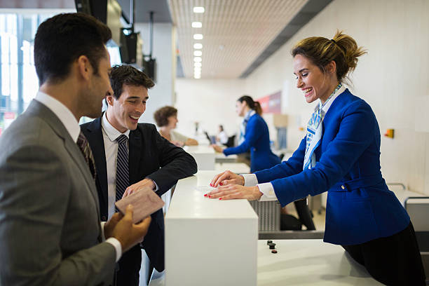 istock Check in counter stewardess and business traveler. 624389568