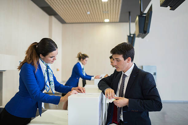 istock Check in counter stewardess and business traveler. 624389722