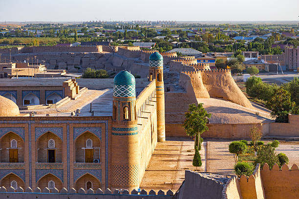 View of the ancient wall of Khiva, in Uzbekistan. View of the ancient wall of Khiva from the watchtower of the Khuna Ark, the fortress and residence of the rulers of Khiva, in Uzbekistan. khiva stock pictures, royalty-free photos & images
