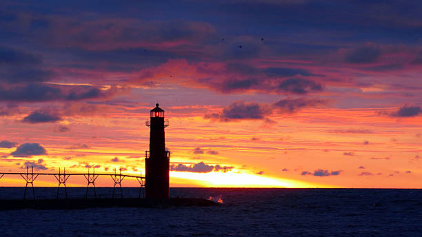 istock Amazing predawn red sky with Lake Michigan lighthouse 624394100