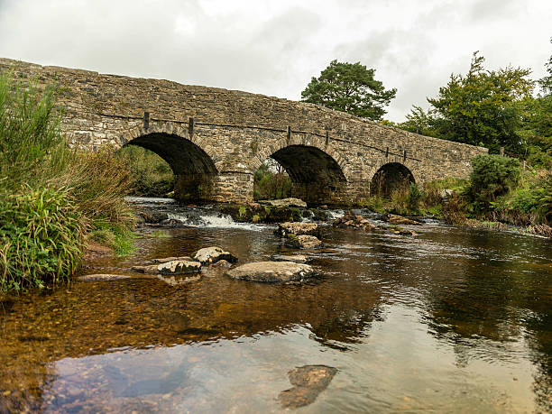 istock Landscape featuring a stone bridge and East Dart river 624394426